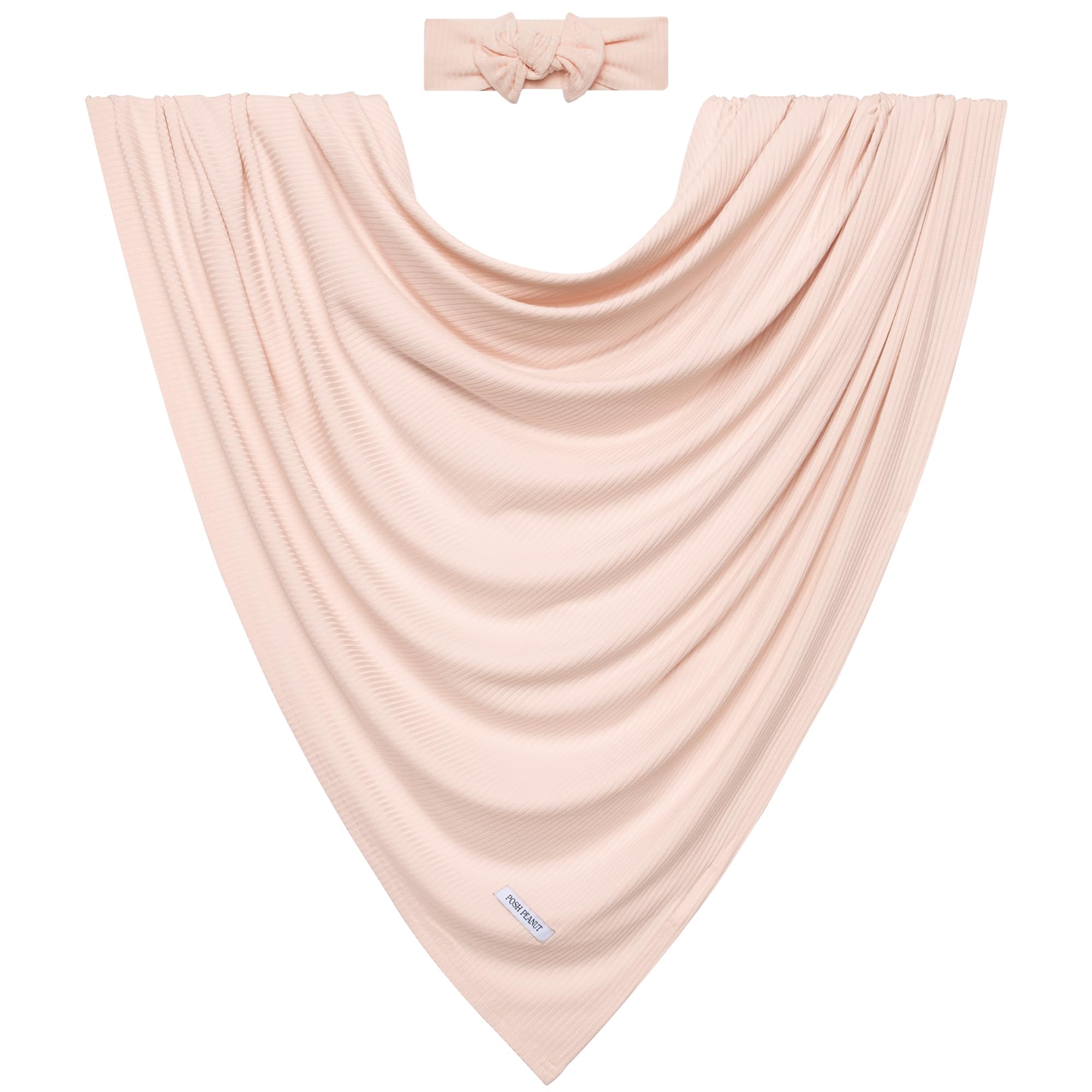 Posh Peanut Sandy Blush newborn in swaddle demonstrating snug, secure wrap.