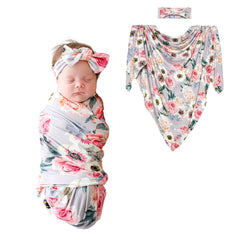 Posh Peanut swaddle blanket in soft bamboo fabric for gentle newborn comfort.