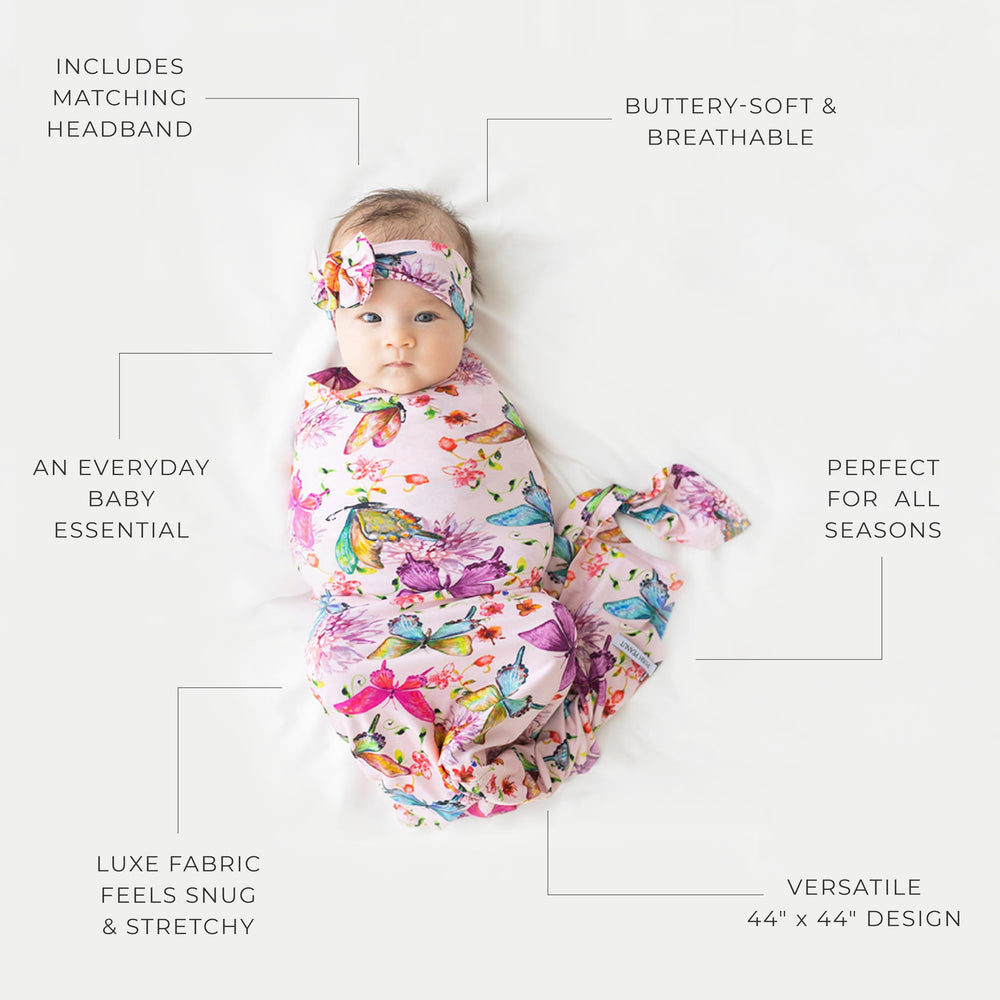 Posh Peanut swaddle in car-seat setup, offering cozy support during transport.