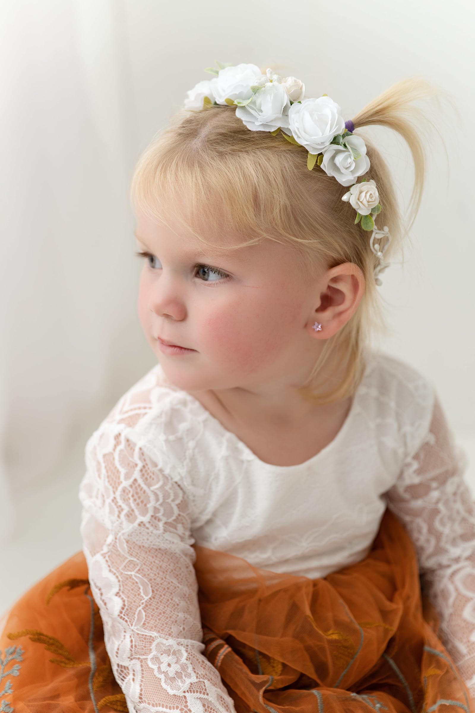 PoshMyra bright white flower crown close-up, handcrafted petals.