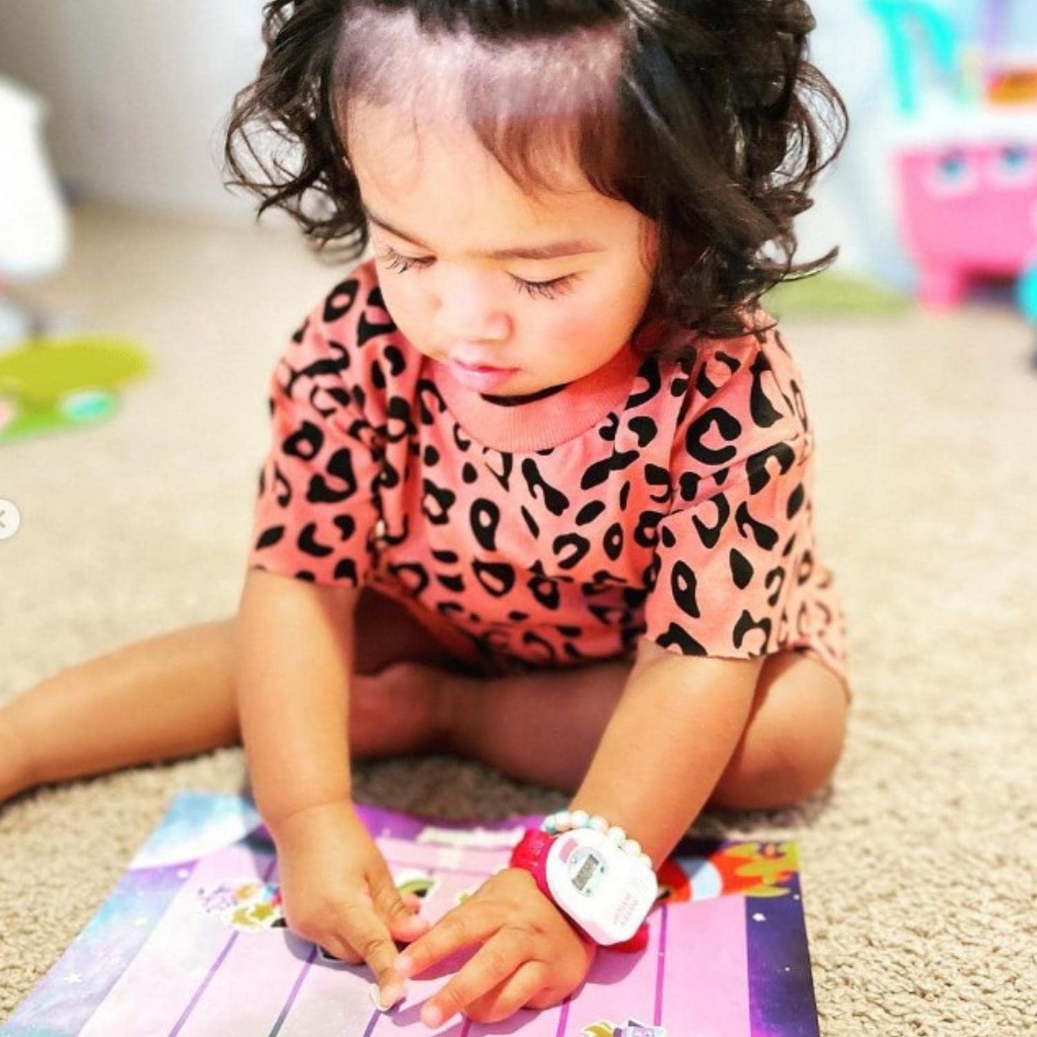 Potty Time child placing sticker demonstrates active participation and motivation.