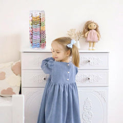 POVETIRE hair bow organizer on a dresser top showing organized accessories.
