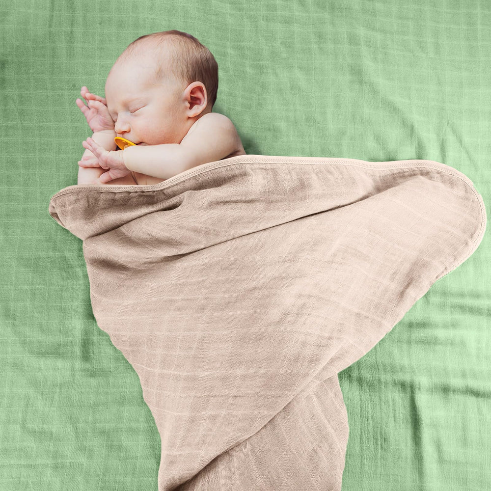Preboun baby bath-time setup with towel and washcloth illustrates practical everyday care