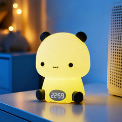 Premier Group panda night light on bedside table with a comforting nursery glow.