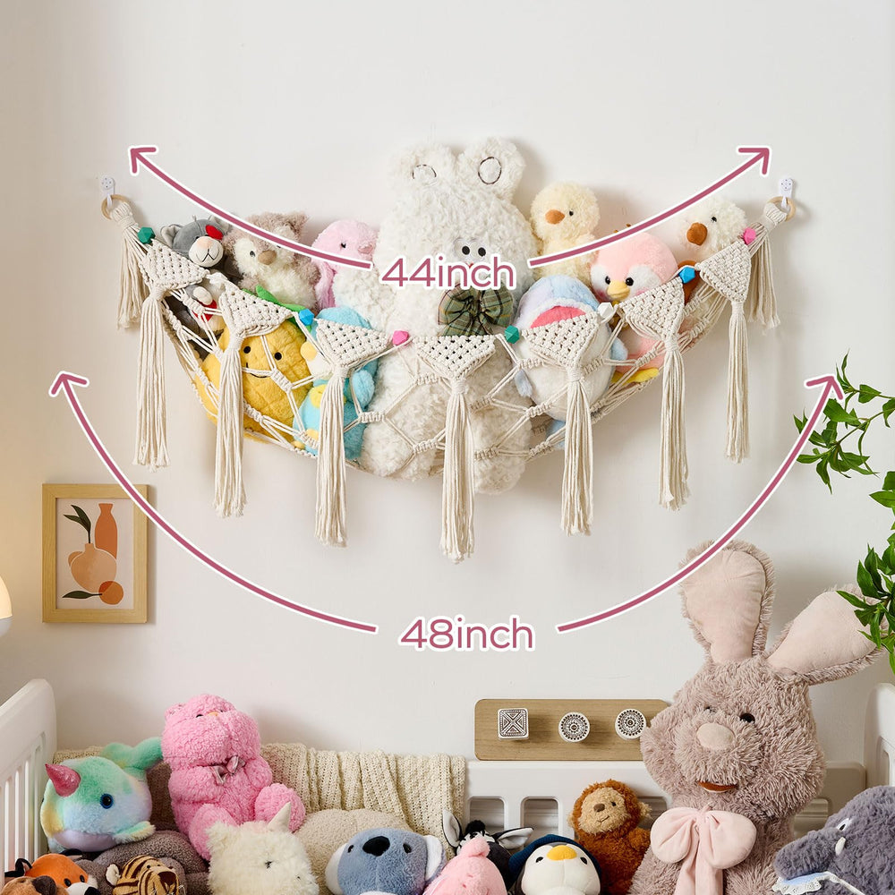 Pretty Jolly tassel accents enhance nursery wall aesthetic.