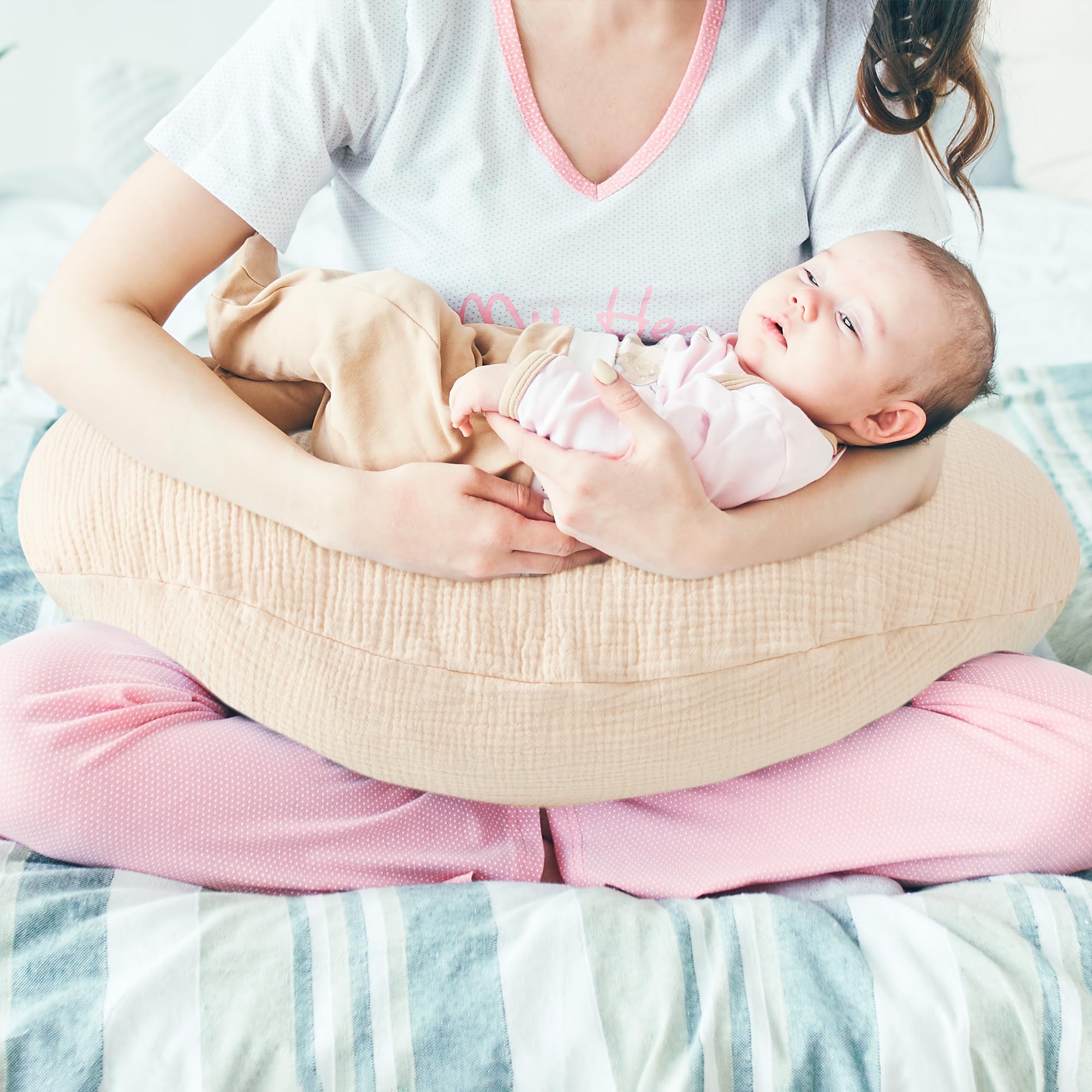 Pro Goleem muslin nursing pillow cover folded demonstrates compact storage and fabric texture