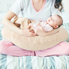 Pro Goleem muslin nursing pillow cover folded demonstrates compact storage and fabric texture