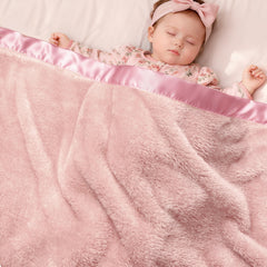 Pro Goleem pink satin-trim fleece baby blanket adds elegant warmth for cuddles.