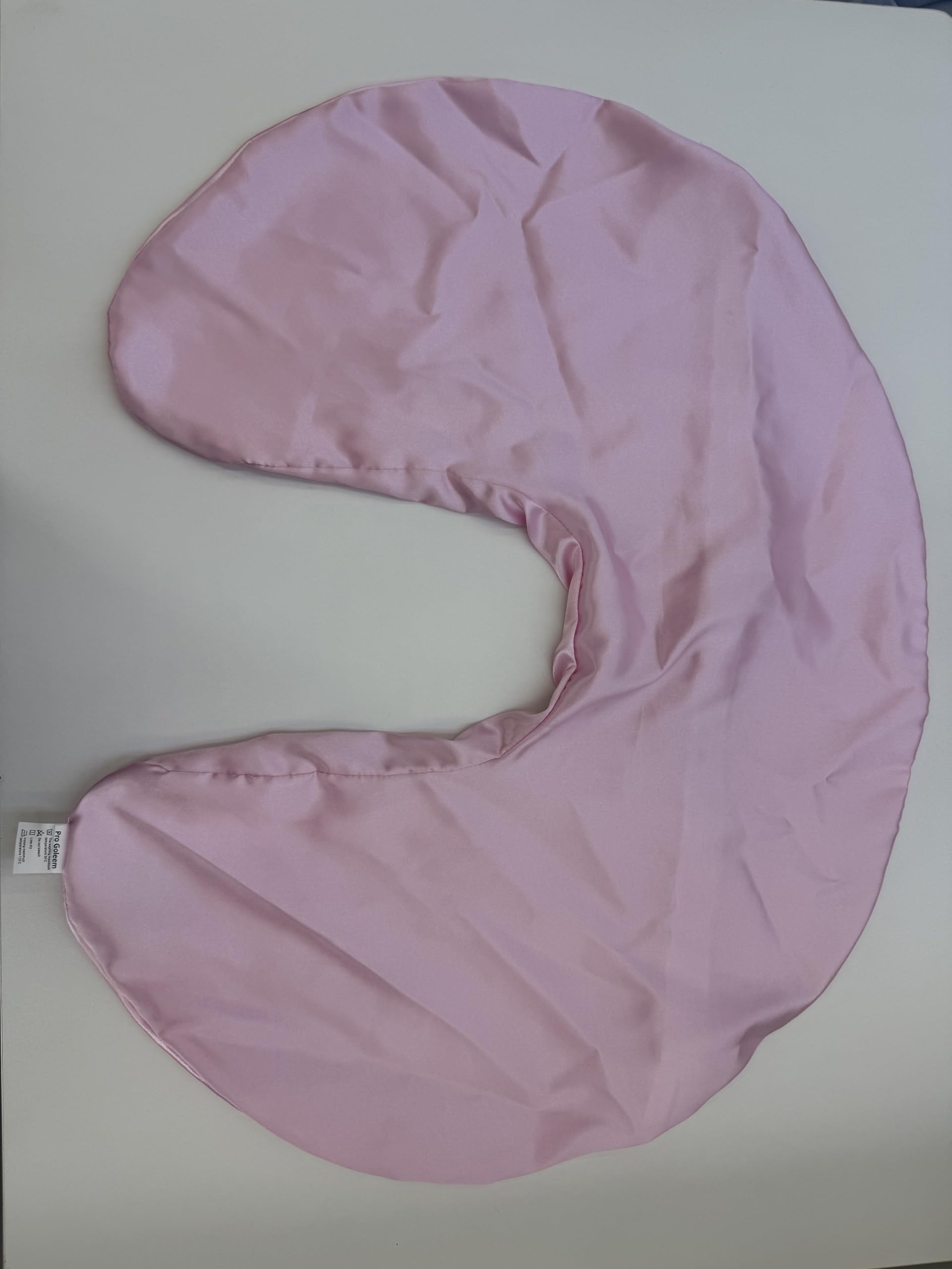 Pro Goleem satin slipcover pink with pillow, highlighting machine-washable durability after regular washes.