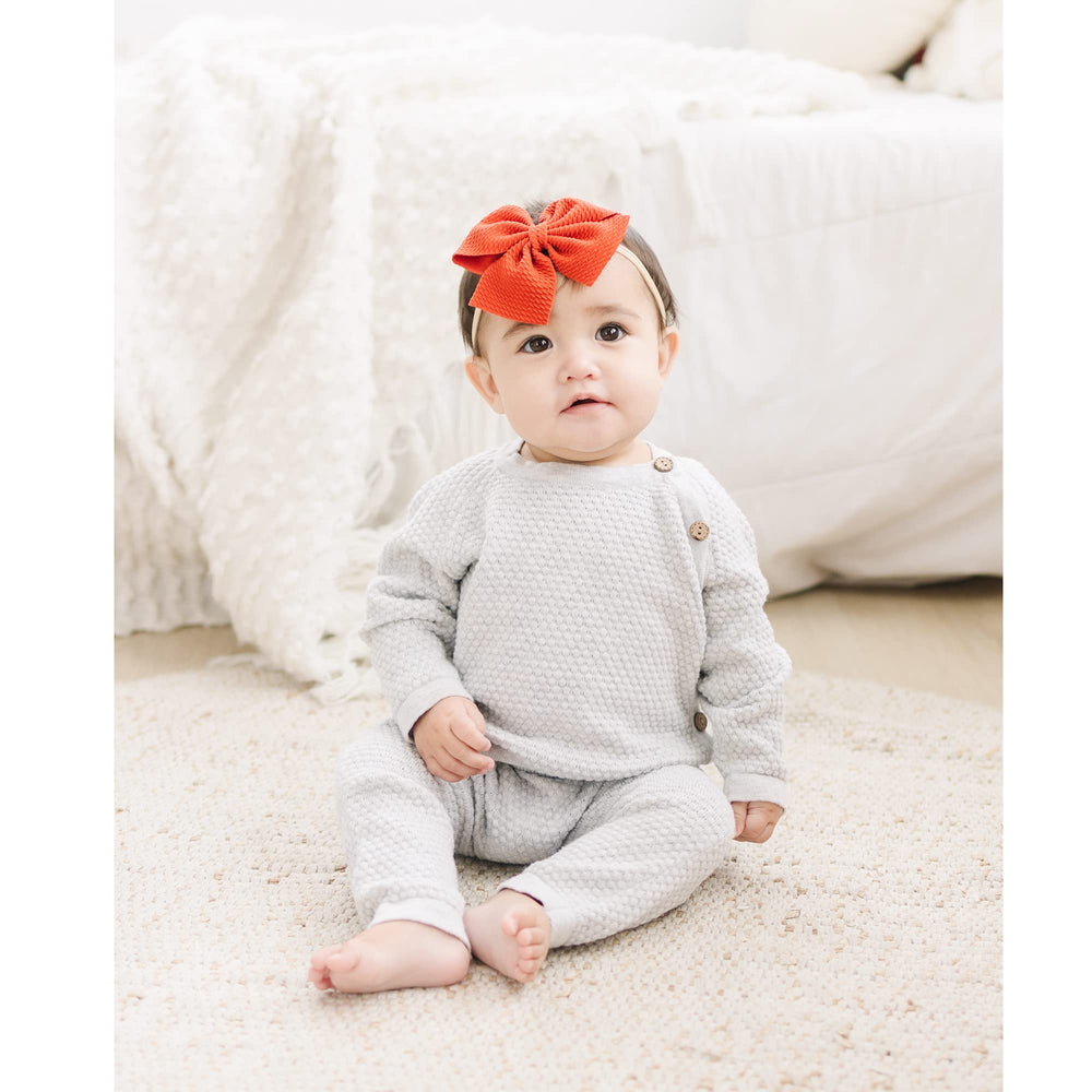 Prohouse hand-sewn bows add craft and charm to tiny hairstyles.