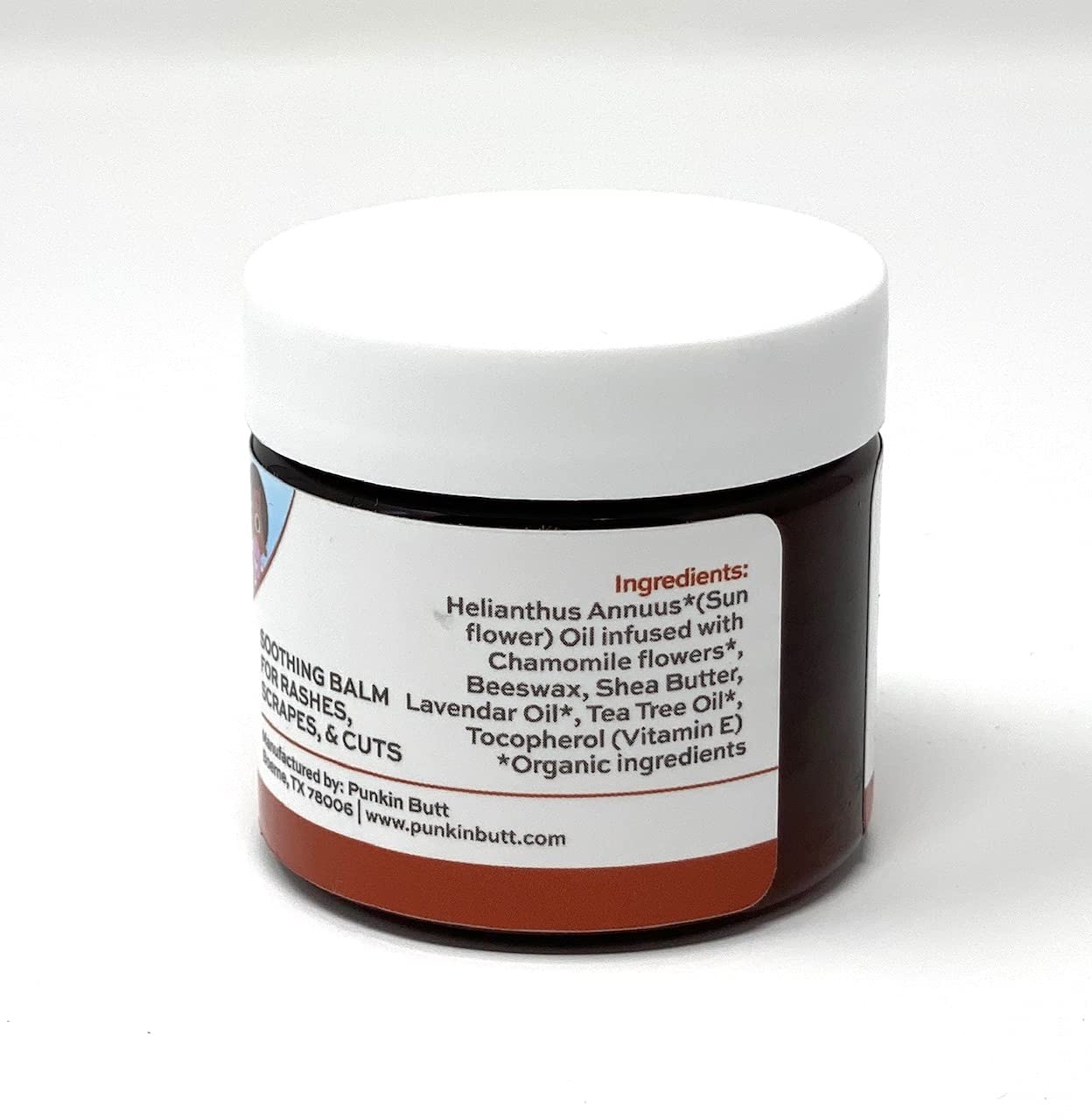 Close-up of Punkin Butt Bottom Balm ingredients with botanical oils.
