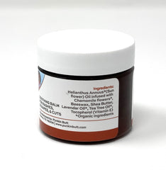 Close-up of Punkin Butt Bottom Balm ingredients with botanical oils.