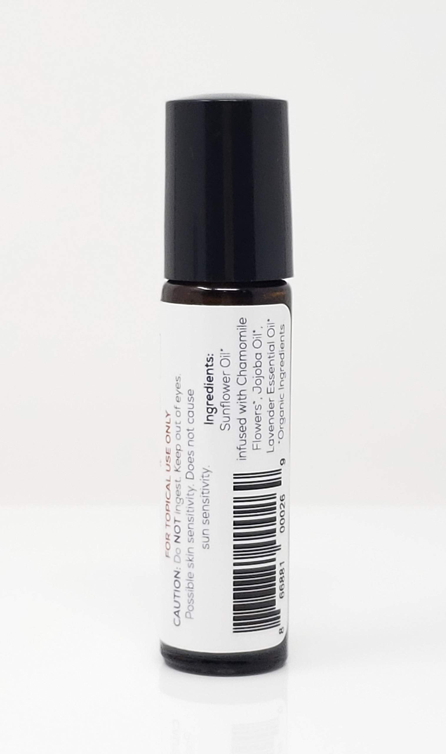 Punkin Butt Lavender Soothing Oil near baby's jawline to ease teething tension.