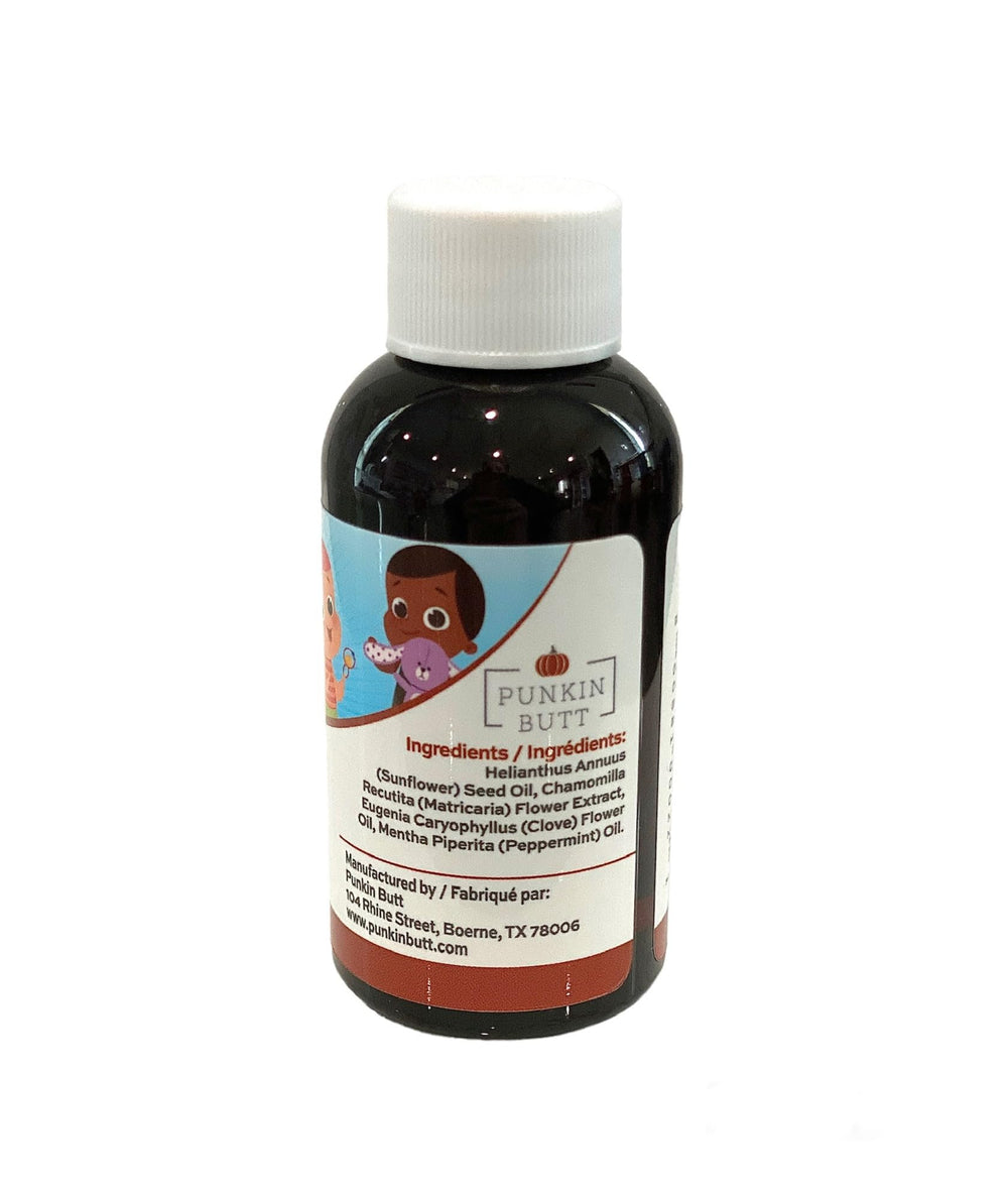 Punkin Butt Teething Oil label closeup highlights chamomile, peppermint, clove ingredients.