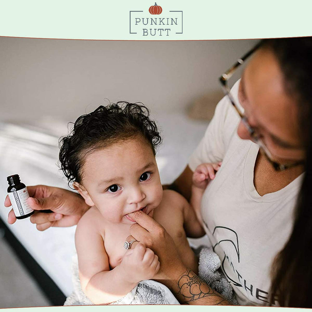 Punkin Butt Teething Oil natural-ingredients illustration emphasizes chamomile, sunflower, peppermint, and clove.