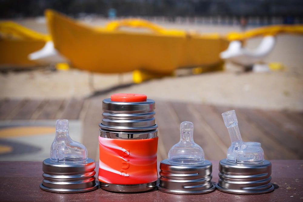 Pura Kiki bottle travel-ready setup with sealing disk for mess-free use.