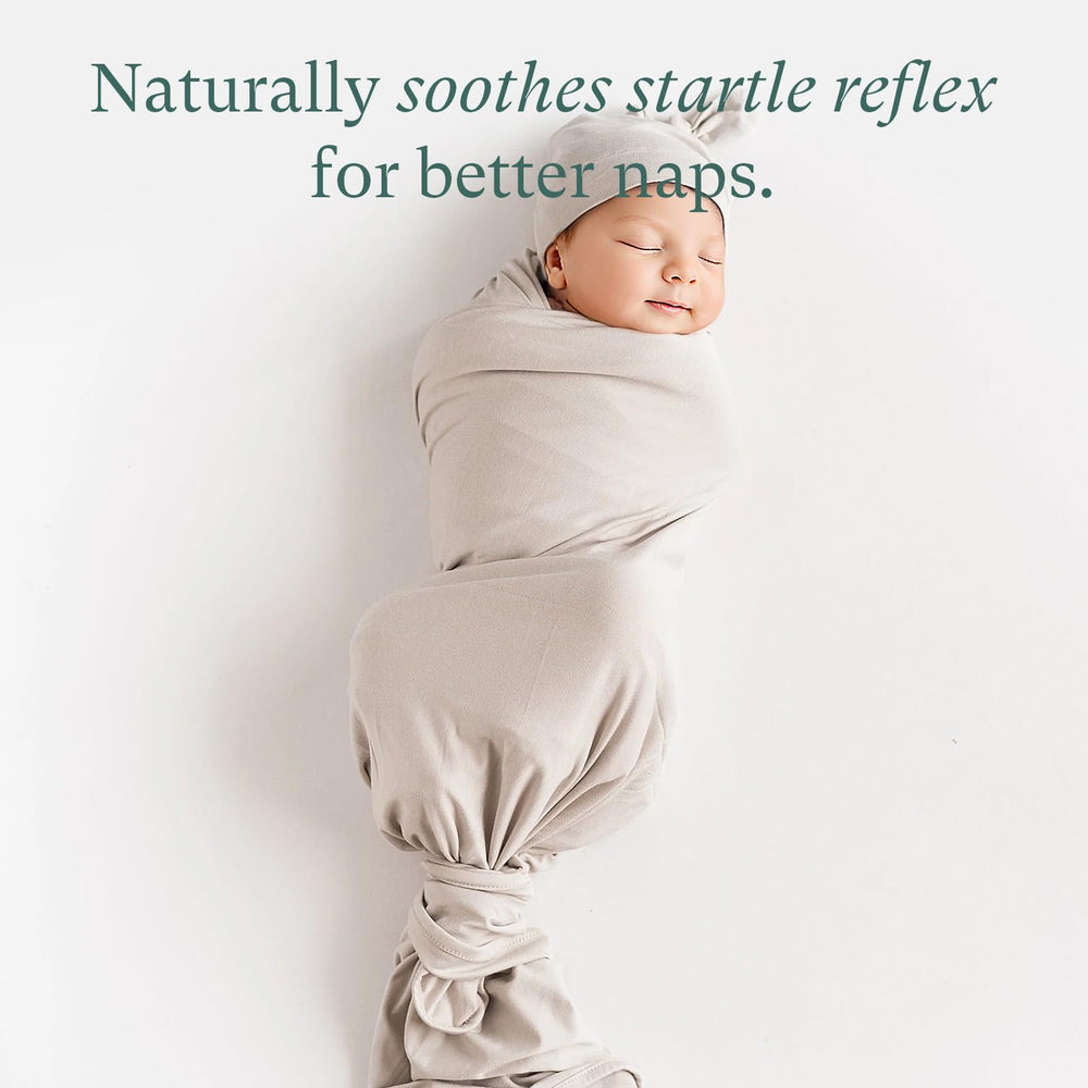 PurComfy swaddle gently wraps baby, reducing arm flail for restful sleep.