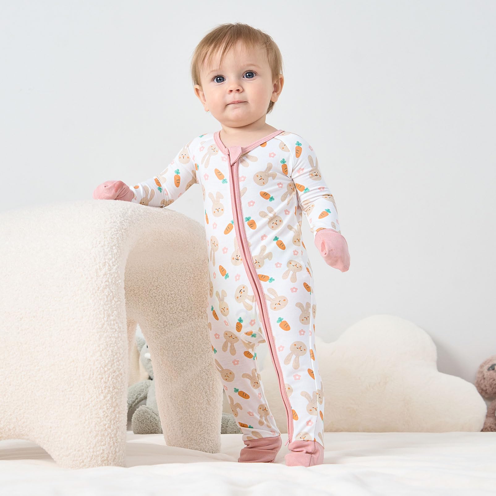 Pureborn sleeper features reversible mittens to prevent scratching during naps.