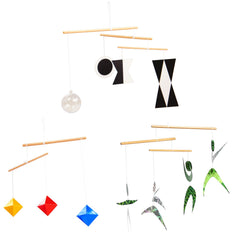 Purgano Montessori Mobile Munari with plastic ball over crib promotes visual tracking.