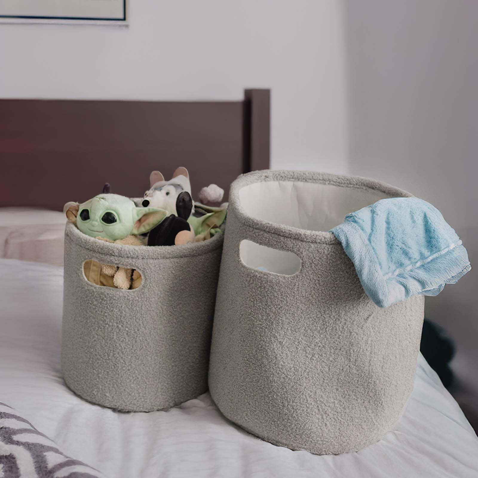 PUTSKA basket round grey with blankets shows cozy storage that fits seating areas.