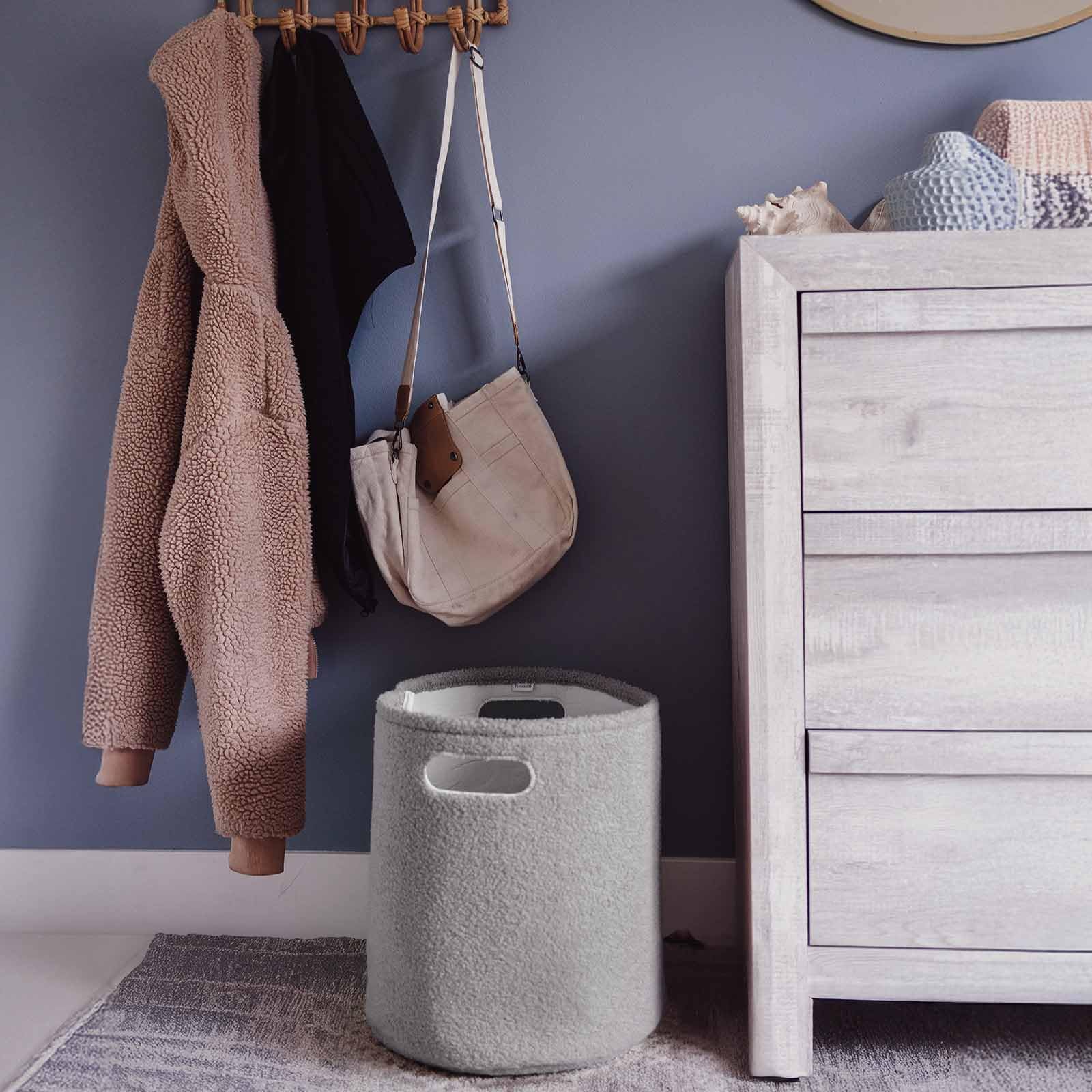 PUTSKA basket round grey in nursery demonstrates versatile storage for essentials and toys.