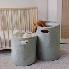 PUTSKA basket round grey side view showcases durable handles for easy carrying.