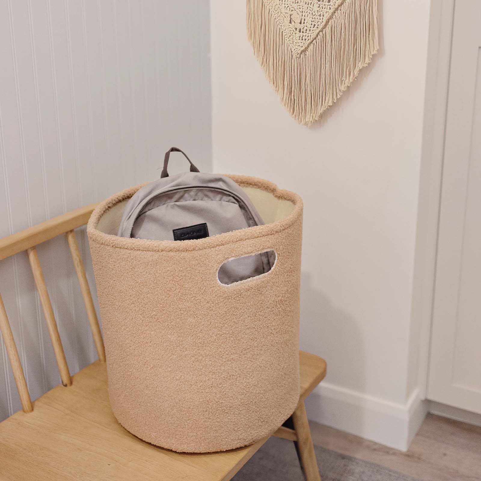 PUTSKA round storage basket with handles makes moving between rooms easy.