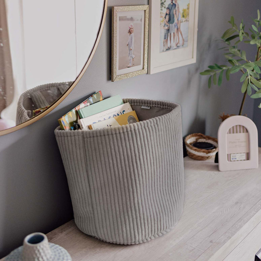PUTSKA Blanket Basket in living room for neatly stored blankets.