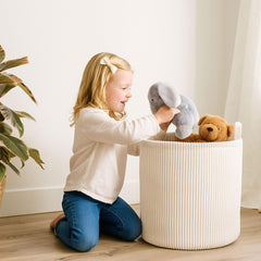 PUTSKA blanket basket round cream in nursery keeps toys tidy and accessible.