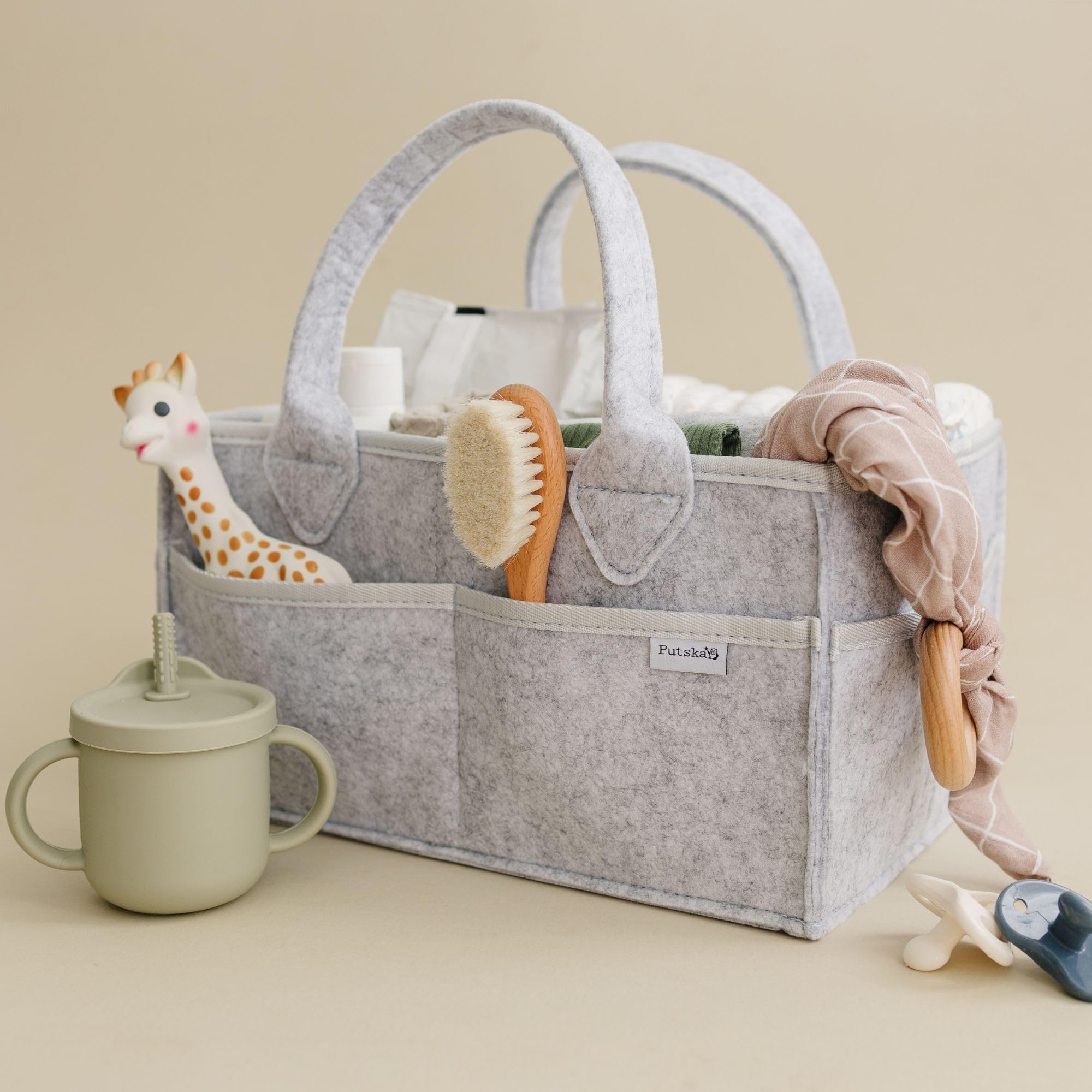 PUTSKA diaper caddy as nursery décor enhancing a grey theme.