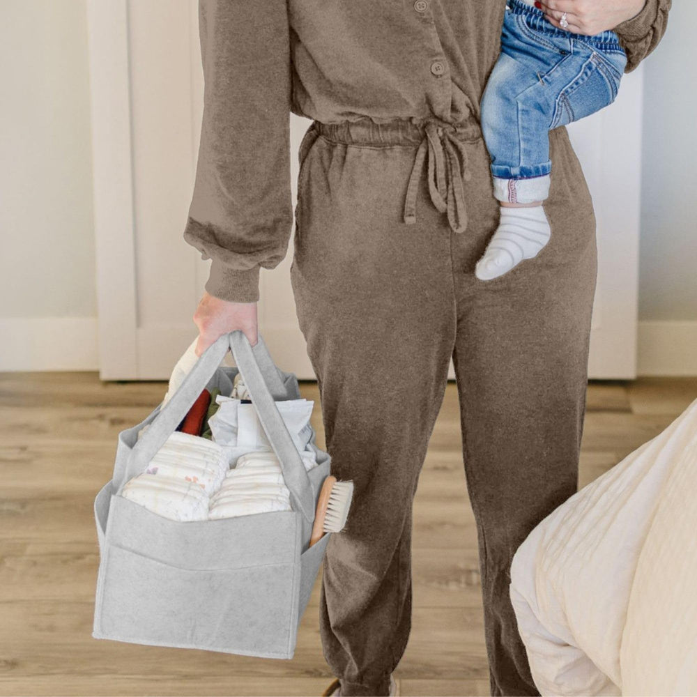 PUTSKA diaper caddy open with removable dividers for customization.