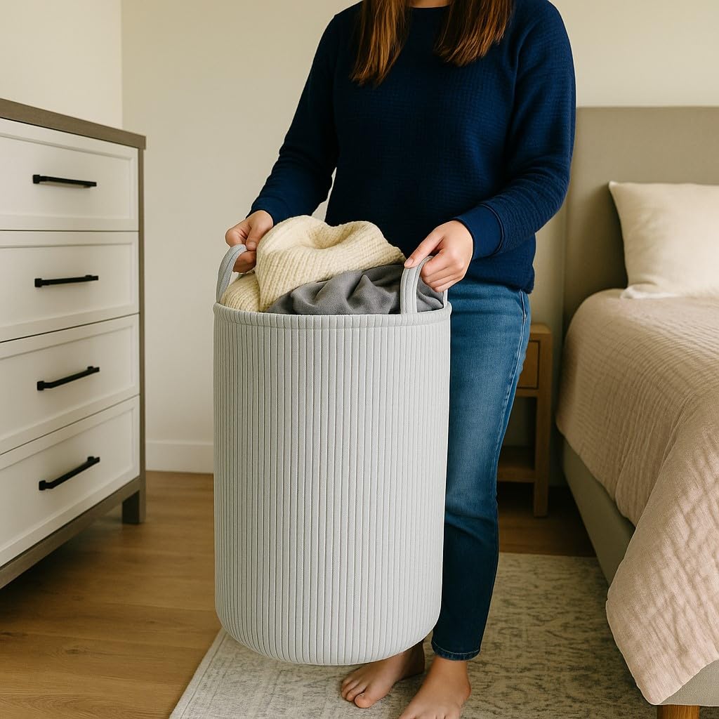 PUTSKA laundry basket grey side view with sturdy handles for easy transport.
