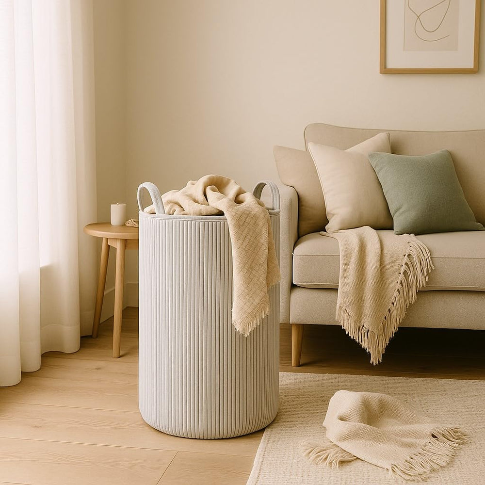PUTSKA laundry basket in living room setup shows versatile storage.