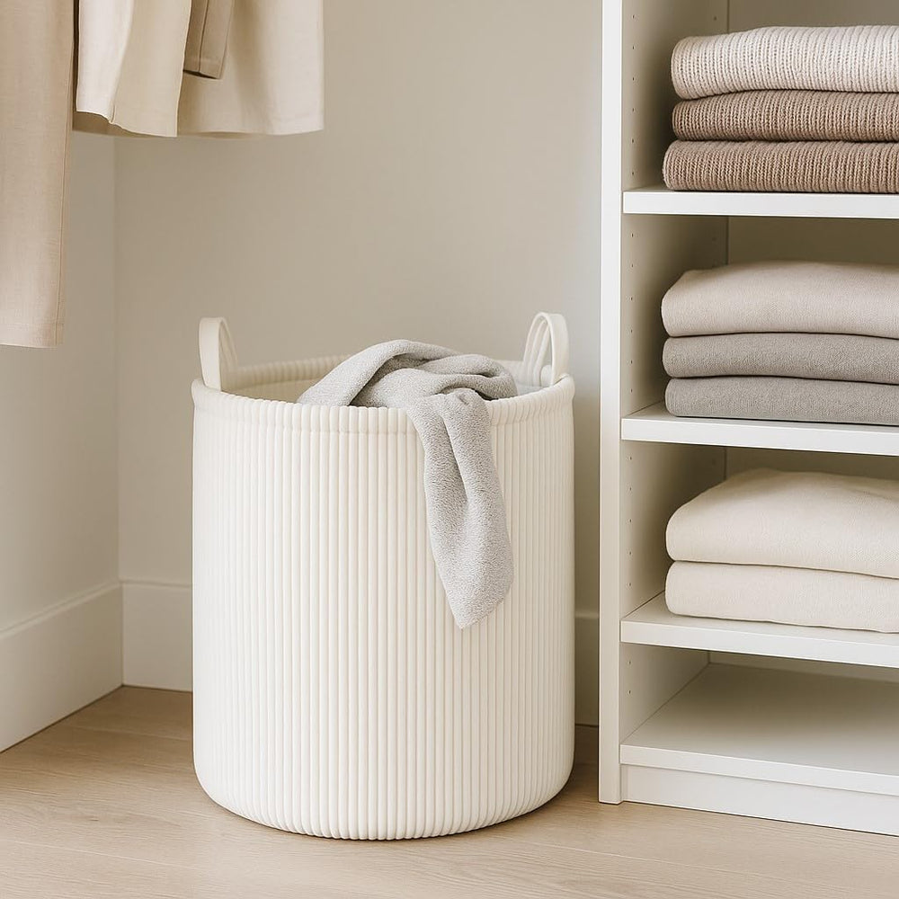 PUTSKA tall laundry basket stands upright even when empty.