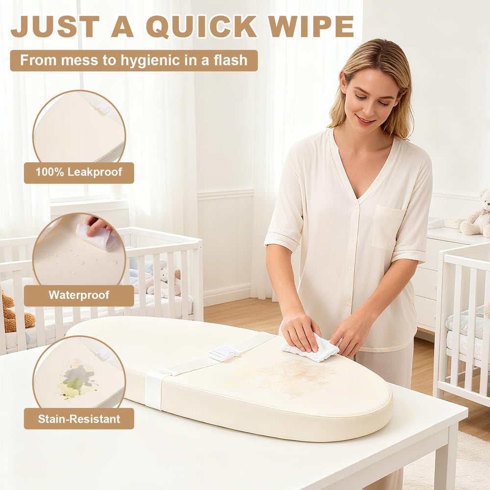 Qalvyn contoured changing pad with foam cushion supporting baby's spine