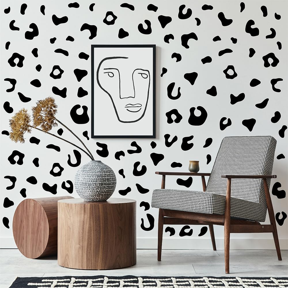 Qaxrocyn multi-size leopard decals enabling layered wall layouts
