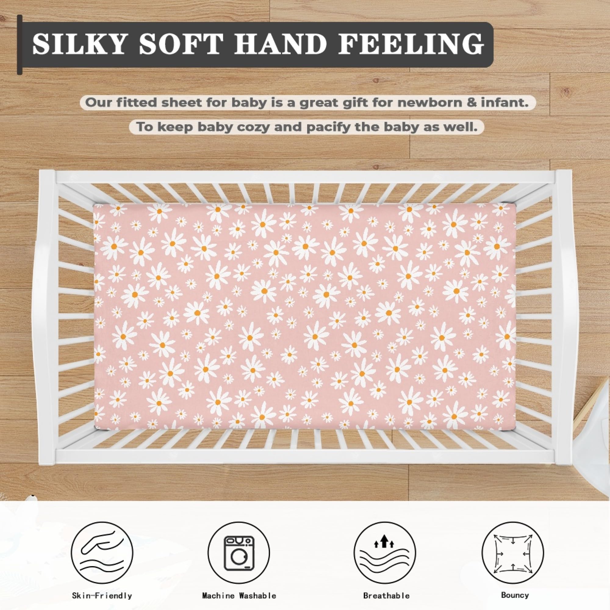 QINBEIDU floral nursery sheet adds a modern boho touch to the room.