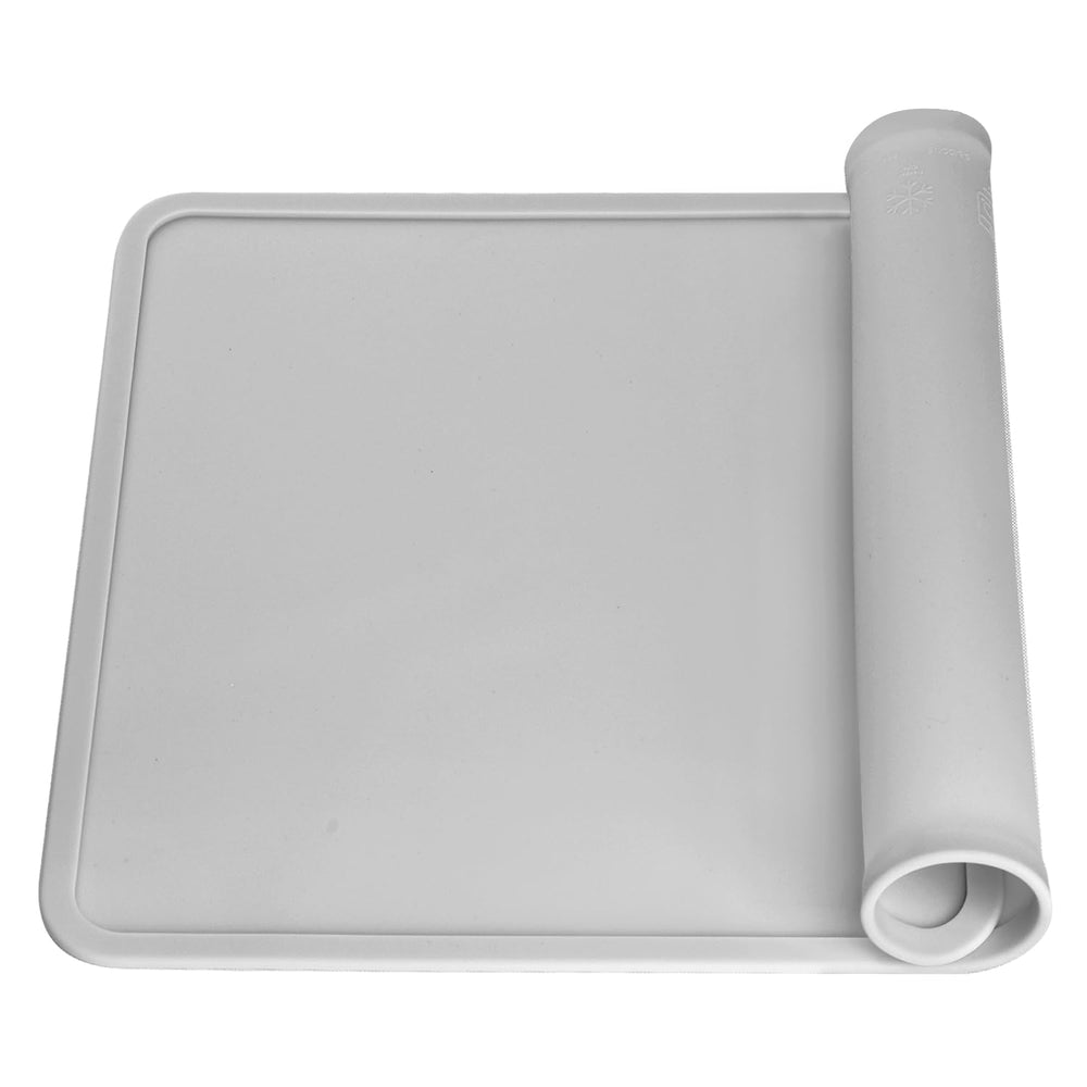 QPIX DIGITAL silicone placemat with raised edges contains spills during meals.