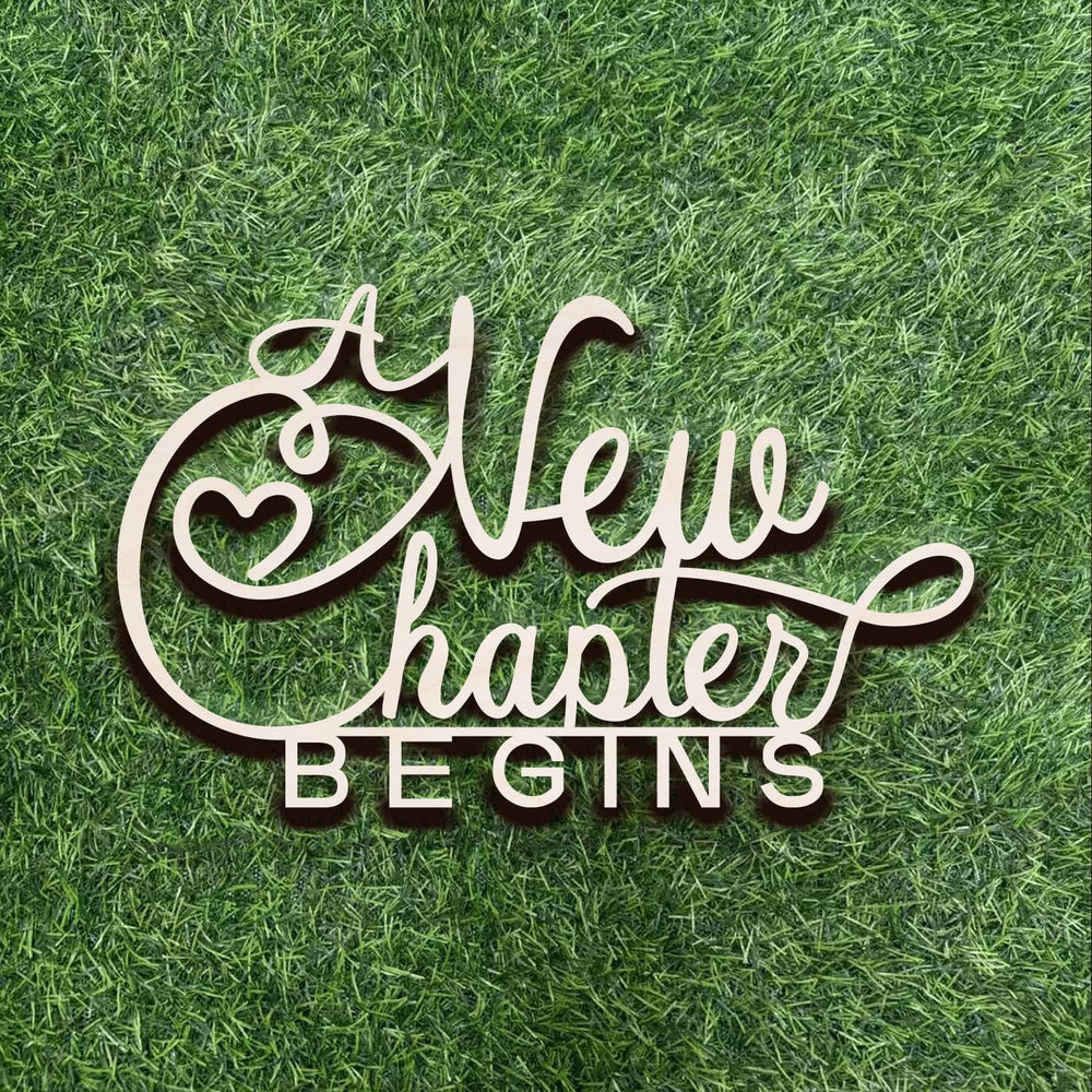 Qualiassu A New Chapter Begins wood sign on wall creates a welcoming bridal backdrop