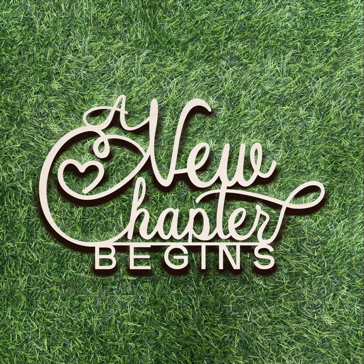 Qualiassu A New Chapter Begins wood sign on wall creates a welcoming bridal backdrop