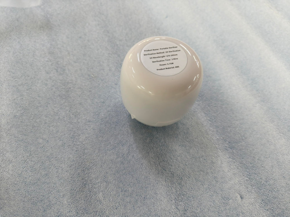 Qualirey disinfection box shown with pacifier and teether items