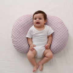 Queness Baby nursing pillow soft-fill supports gentle bottle feeding.