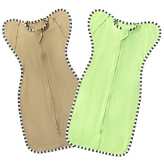 QUENESS BABY transitional swaddle front view in light green and tan for cozy nights