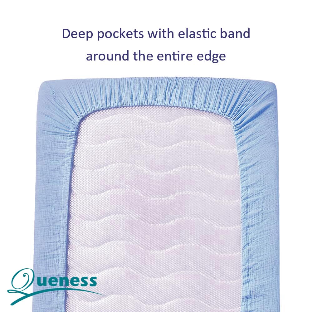 QUENESS muslin crib sheet fits standard crib securely for easy sheet changes.