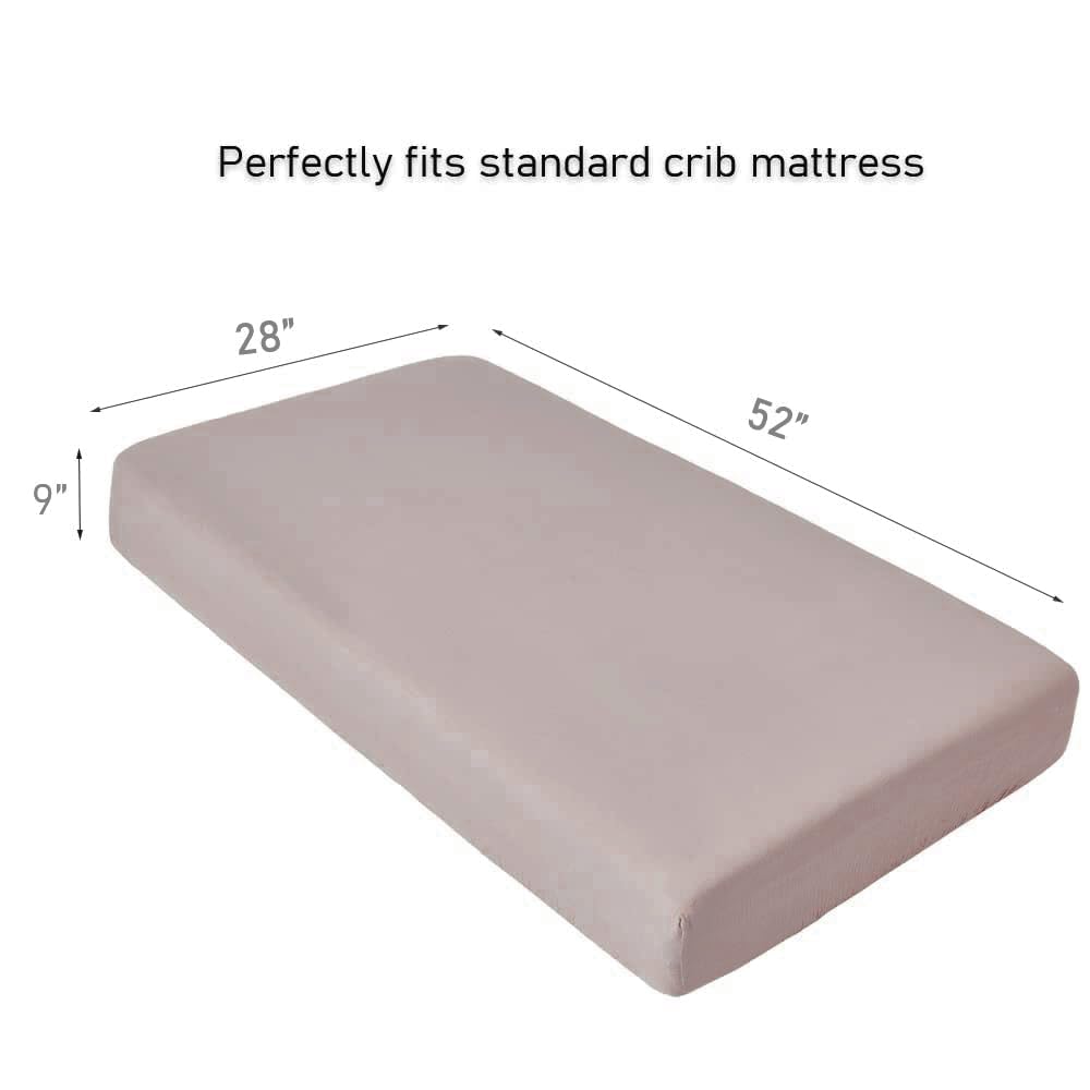 QUENESS muslin crib sheet on crib mattress demonstrates secure, fitted design.