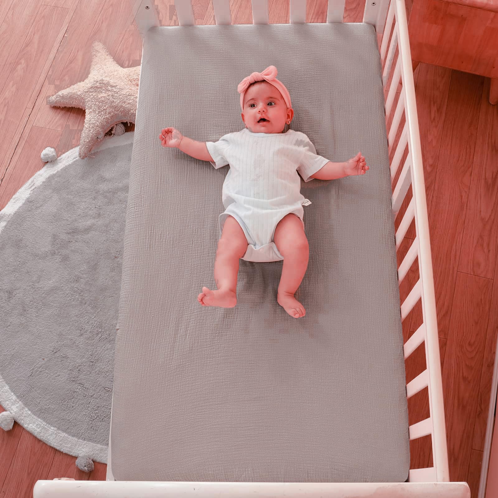 QUENESS muslin crib sheet khaki neutral tone complements various nursery decor.
