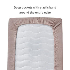 QUENESS muslin crib sheet khaki on toddler bed size, versatile choice as baby grows.