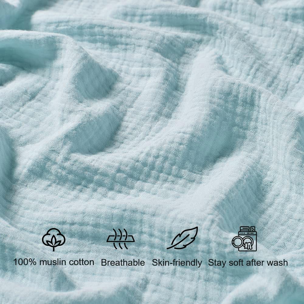 QUENESS muslin crib sheet in light blue adds soft, breathable comfort