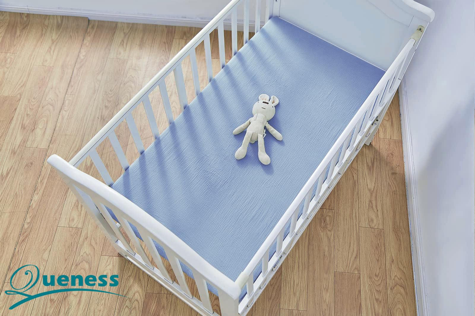 QUENESS muslin crib sheet fits toddler mattresses for growing babies.