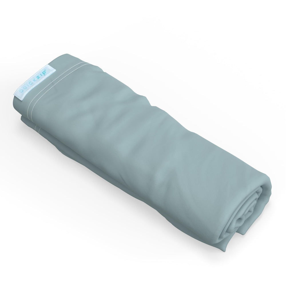 QuickZip Crib Extra Zip-On Sheet dusty blue close-up shows soft cotton for quick changes